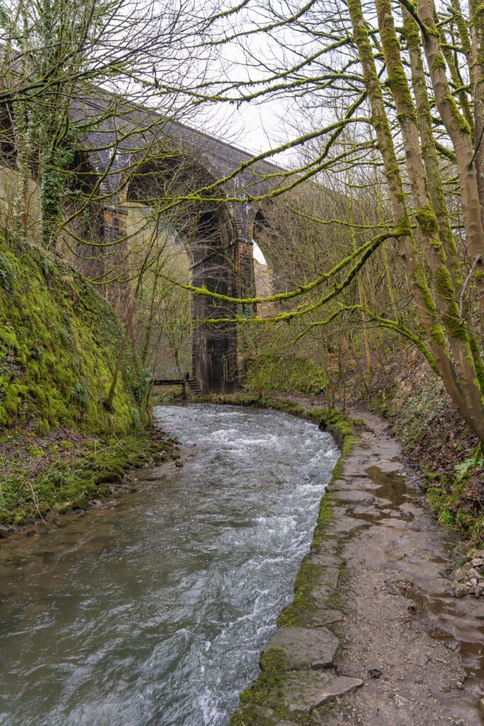 Monsal trail bridge going over the river Wye and footpath