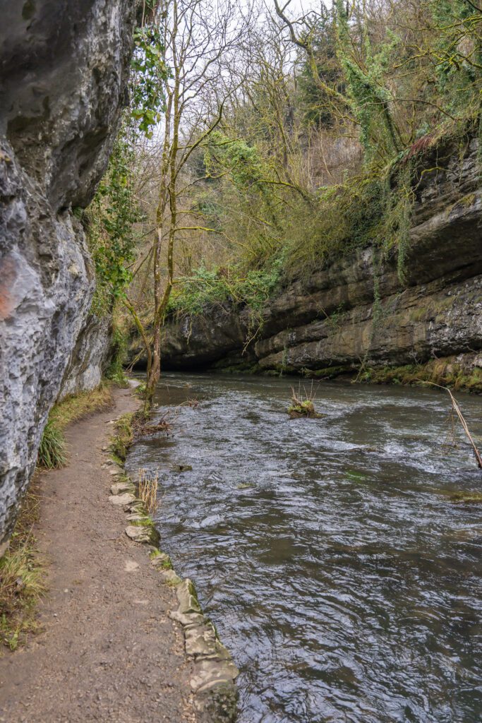 riverside footpath through a deep limestone gorge
