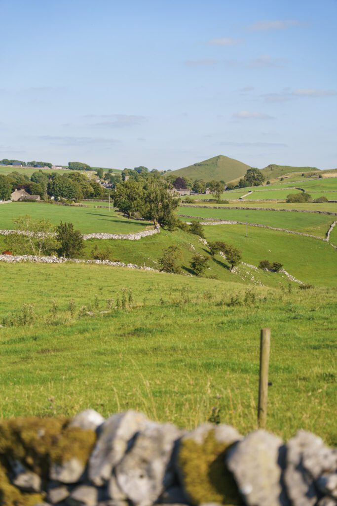 view over a dry stone wall of the countryside and hills