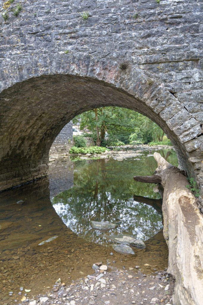 View under the bridge at Wetton Mill above the river