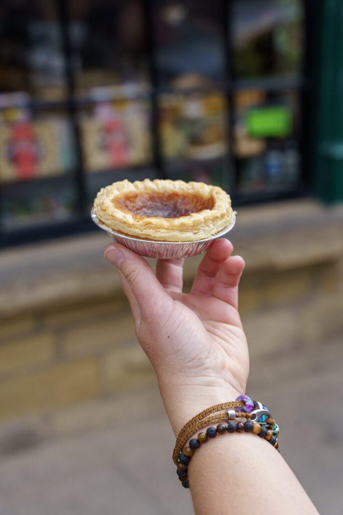 Bakewell pudding being held outside the original Bakewell pudding shop