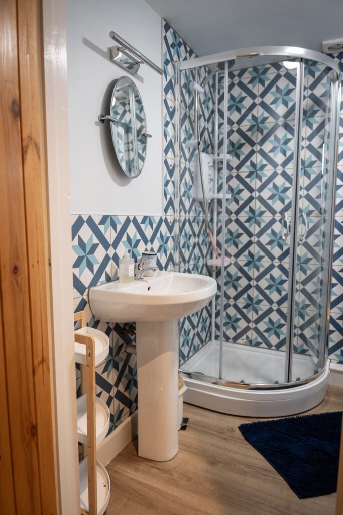 Shower room with corner shower sink and mirror