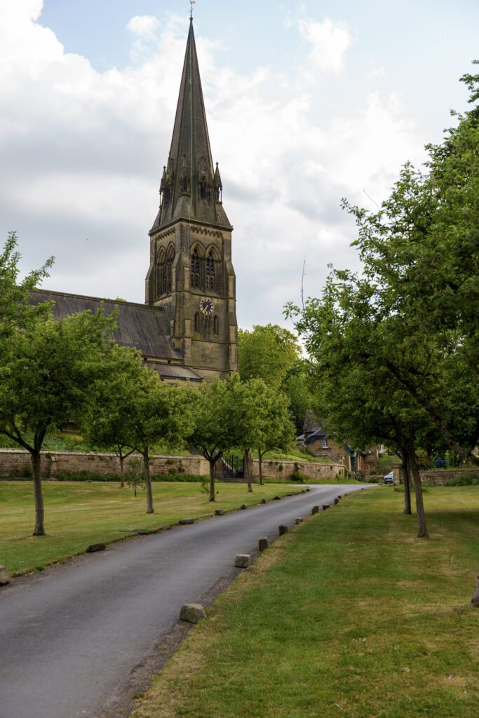 Edensor Church and tree lined avenue leading upto it