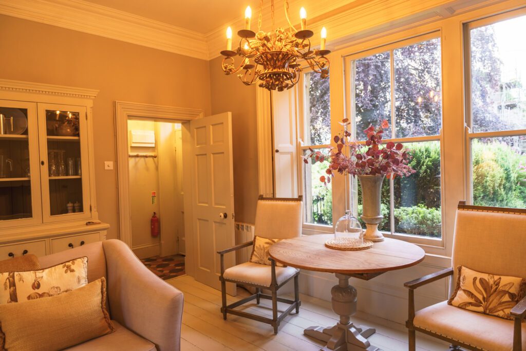 Alstonefield Manor Living Room with large windows to the front looking out into the garden