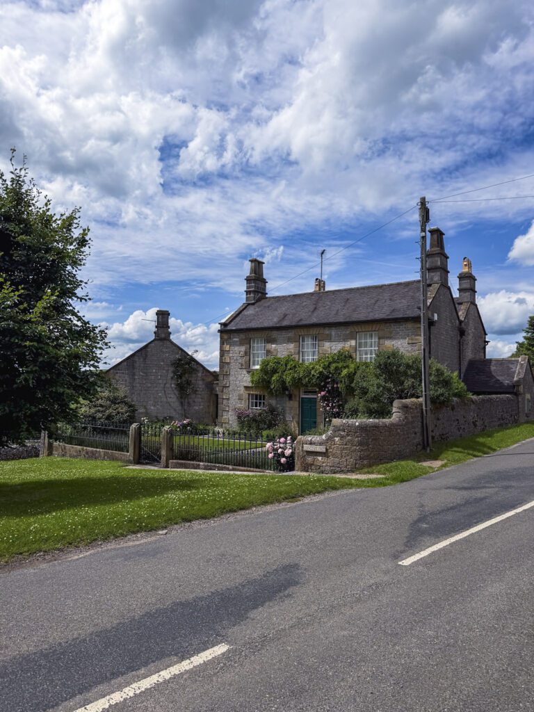A large stone cottage in Alstonefield on the roadside