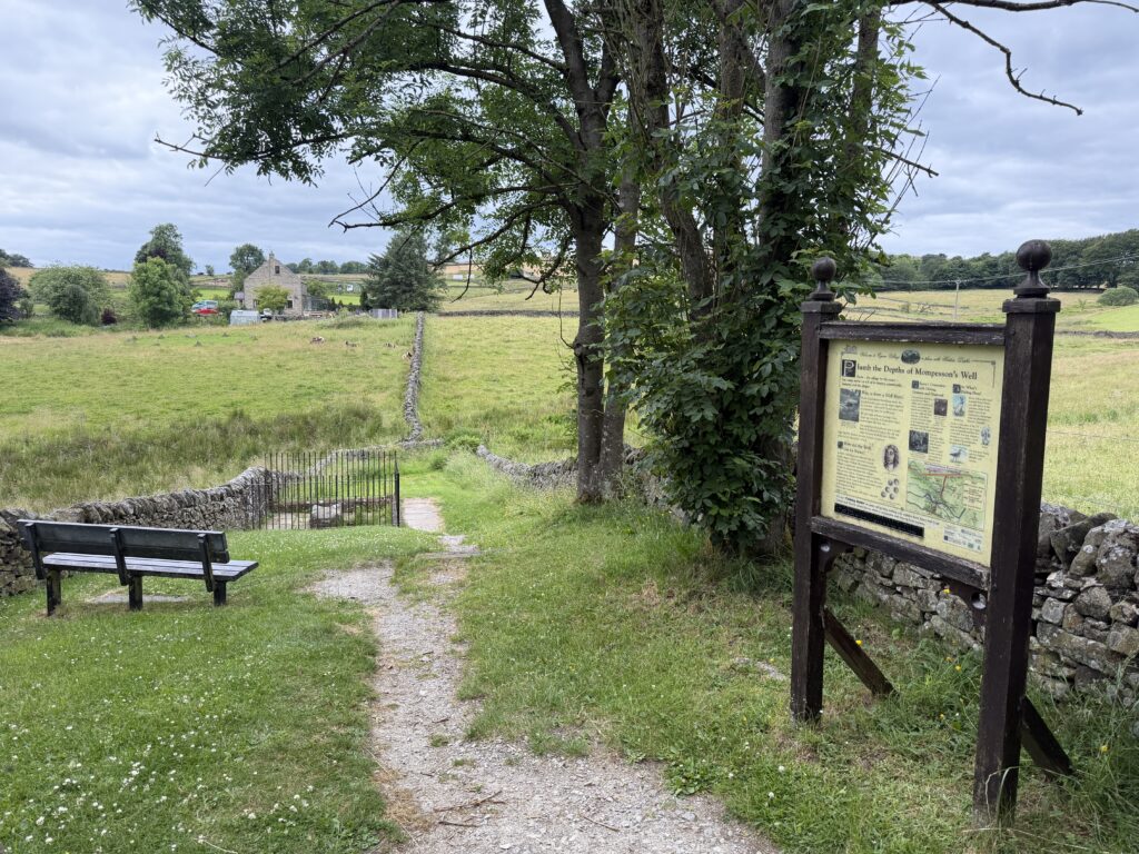 Mompesson's well, information board and a seat to look over it