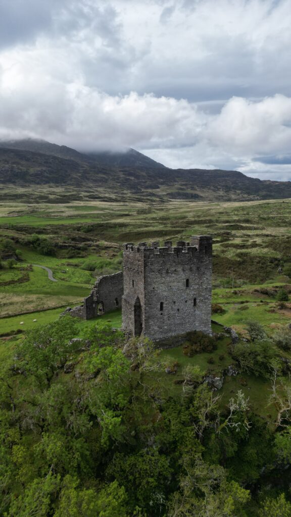 Dolwyddelan Castle from above surrounded by Welsh countryside