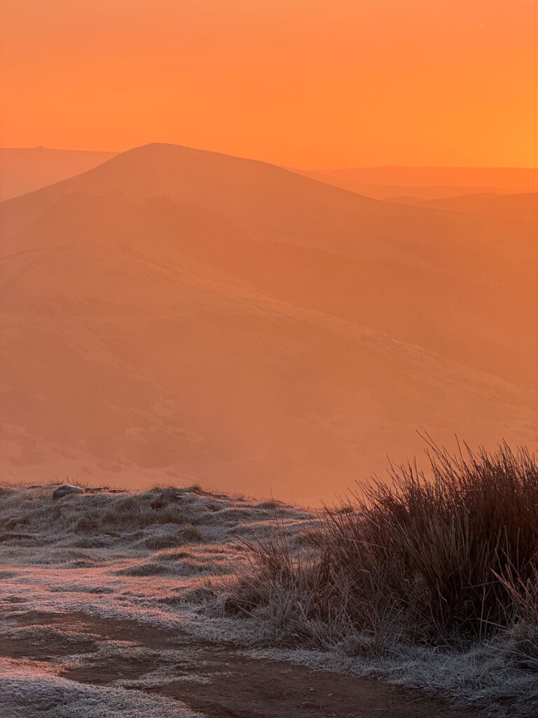 Frosty sunrise on Mam Tor with really orange glow