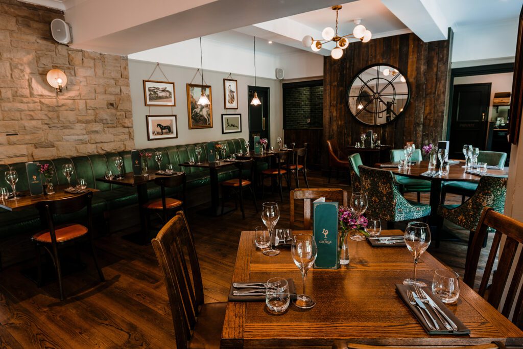 Dining room at The George, Hathersage, set for dinner service