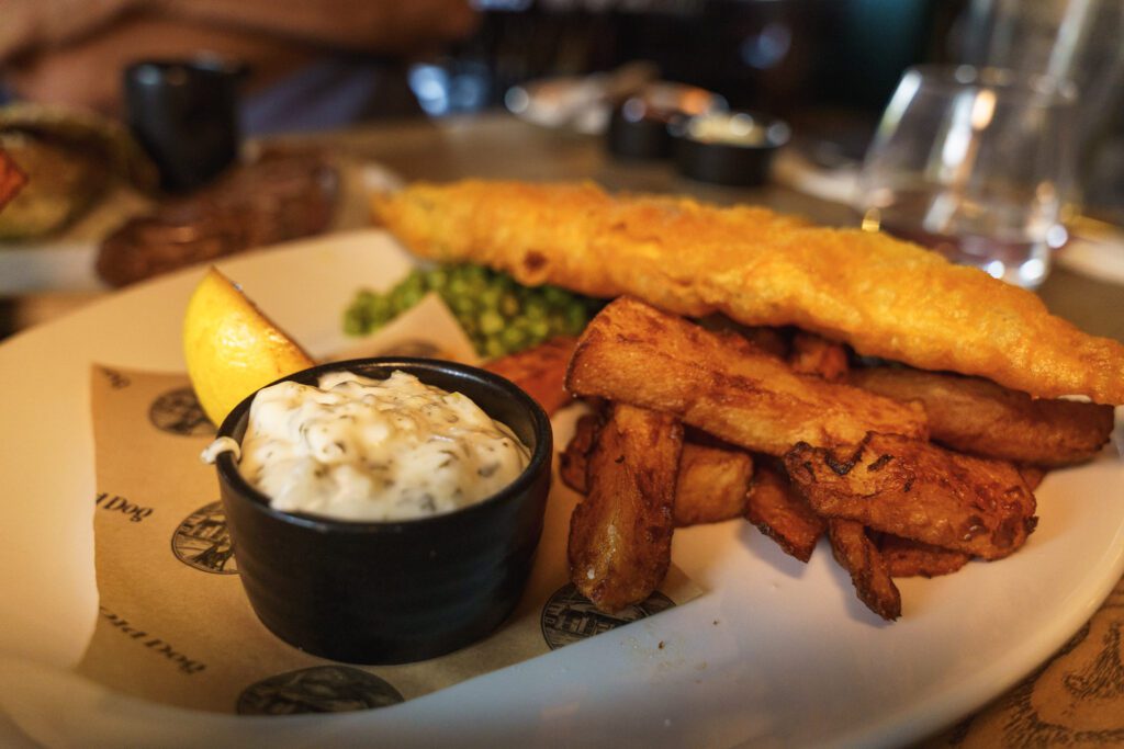 Golden battered fish, chunky homemade chips, tartare sauce and charred lemon