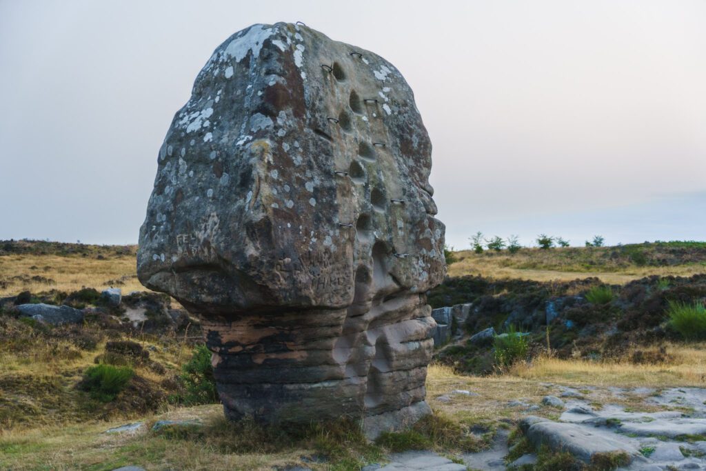 The Cork Stone on Stanton moor, foot and hand holds to climb the stone
