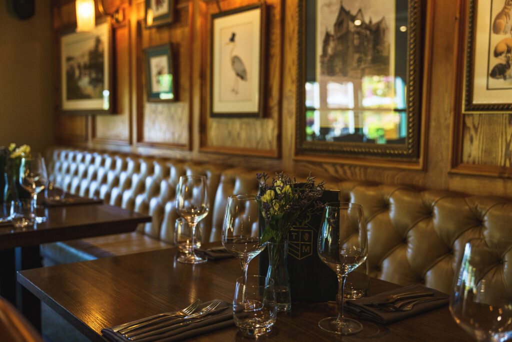 The Maynard restaurant, brown Chesterfield style bench seating