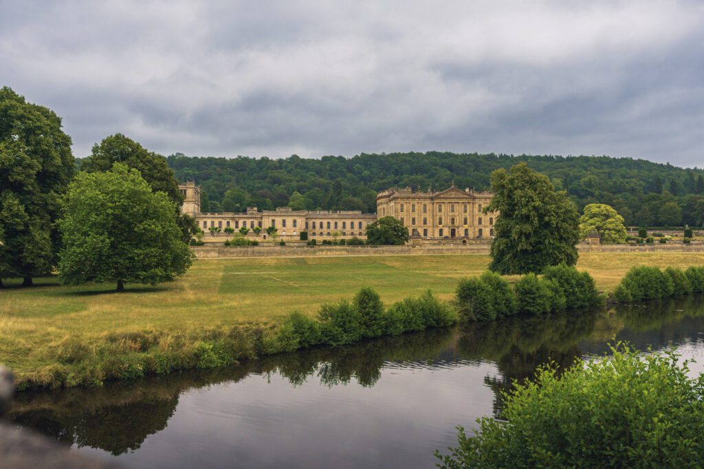 Chatsworth House and The River Derwent shot from the bridge on a cloudy day