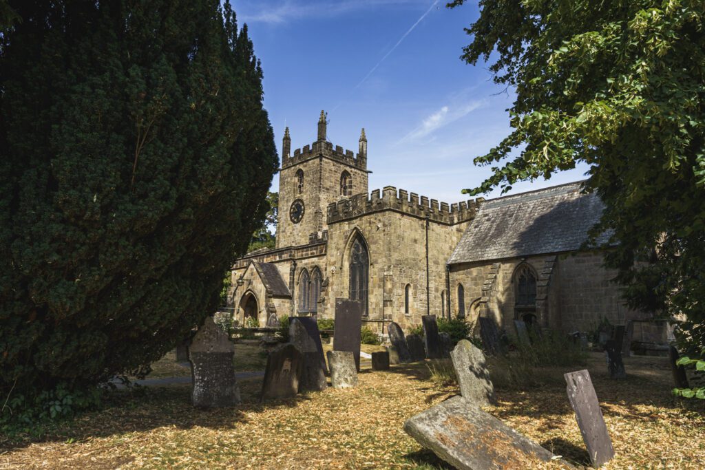 Church and graveyard at Rowsley, old gravestones and big trees