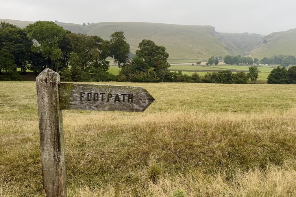Footpath sign looking towards open countryside and Winnats Pass
